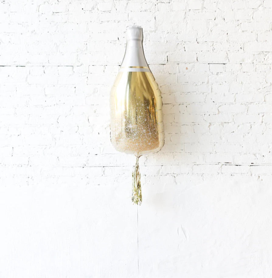 Goldene Champagnerflasche mit Rock